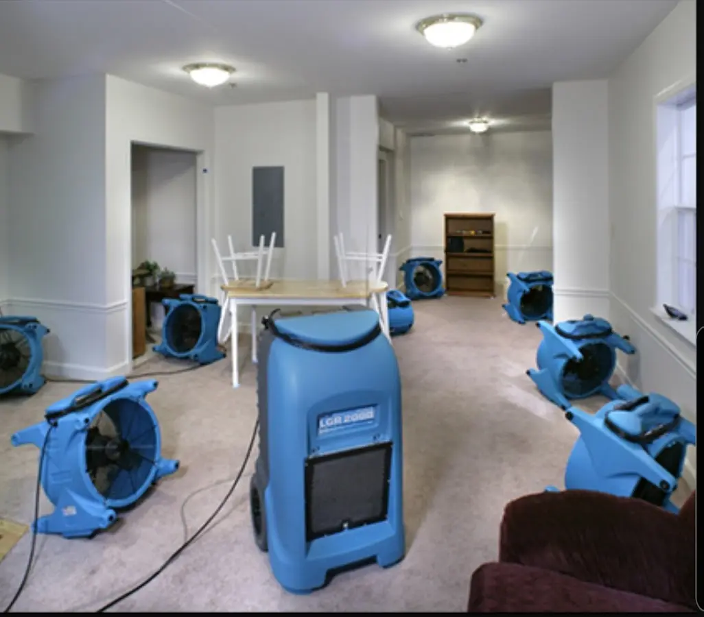 Air movers and dehumidifier setup for Water Extraction & Removal in Garrison